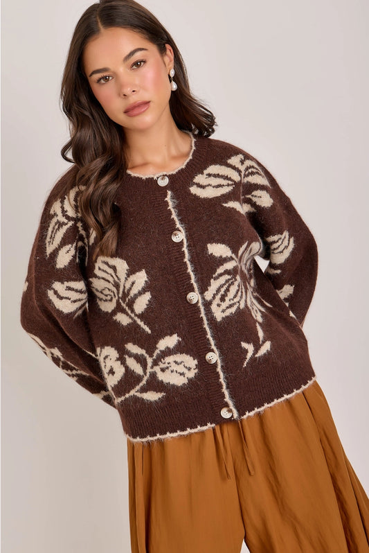 woman in floral cardi and skirt