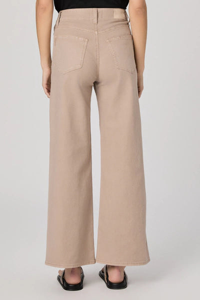 Beige wide-leg pants worn by a person on a plain background