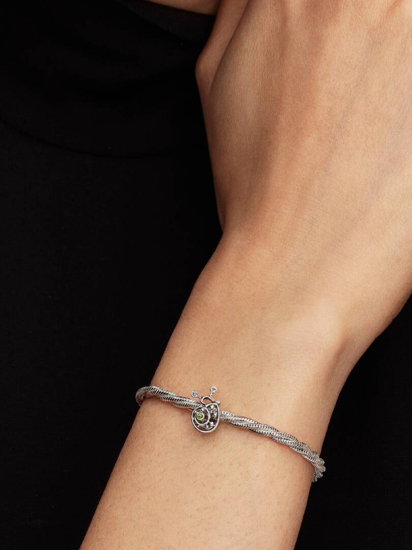 charm bracelet with snail charm