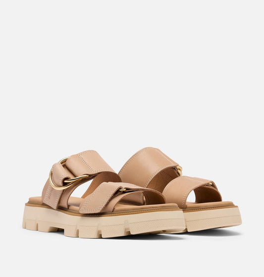 Beige sandals with a chunky sole on a light gray background