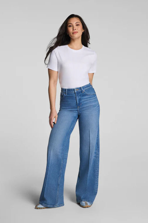 woman wearing white tee with jeans