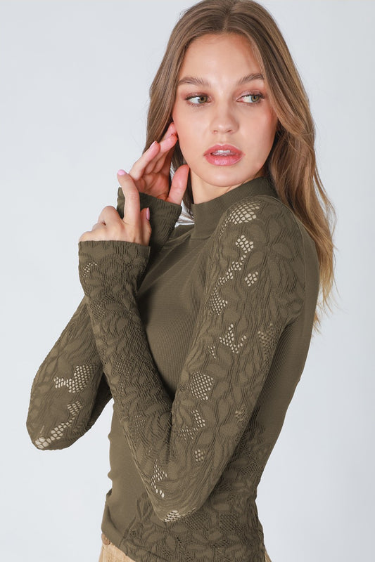 woman in long sleeve top