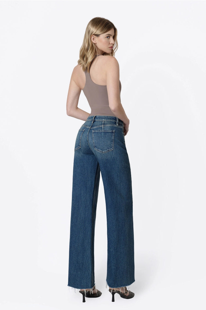 woman in tank and jeans