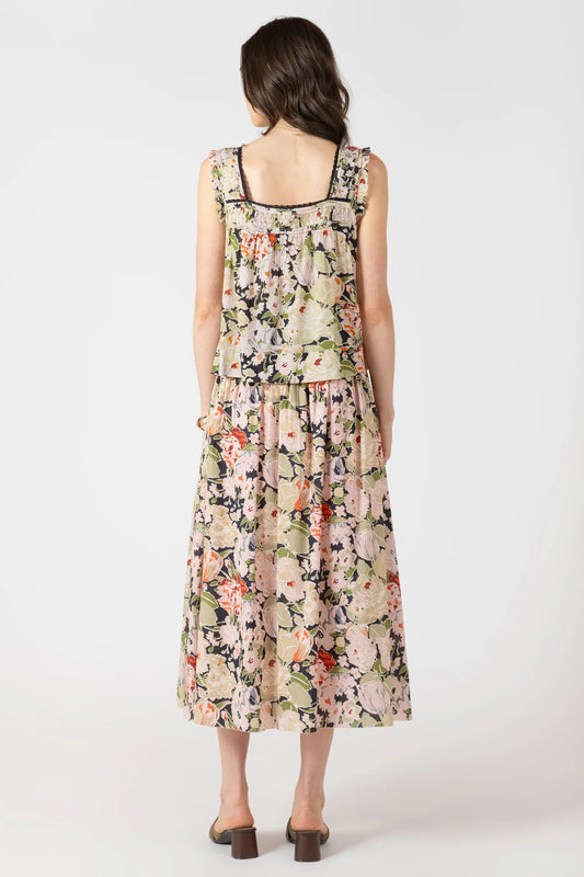 Woman wearing a floral dress on a white background