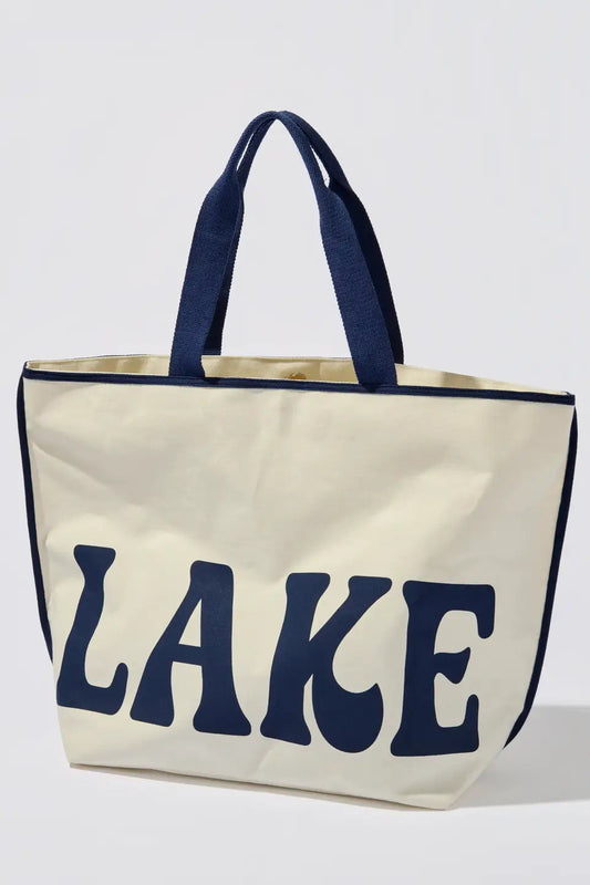 Beige tote bag with navy handles and 'LAKE' text on a white background