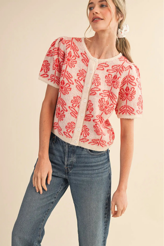 woman in floral cardigan and jeans