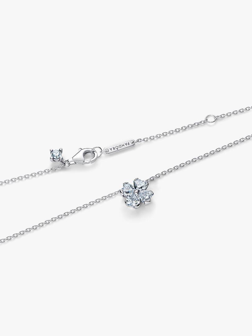 Silver necklace with a heart-shaped clasp on a white background