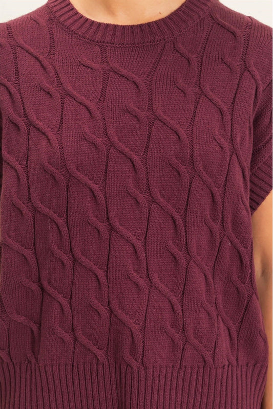 woman in cable knit sweater