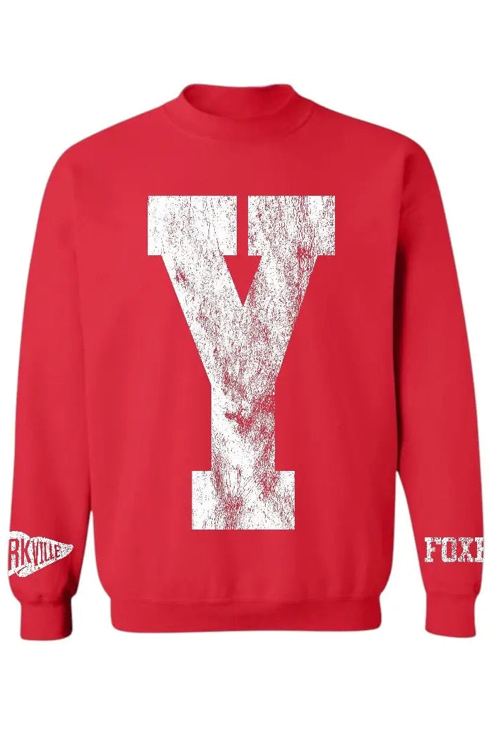 A red crewneck sweatshirt featuring a large distressed white block letter 'Y' on the front, with 'RKville' on the right sleeve cuff and 'FOX' on the left sleeve cuff.