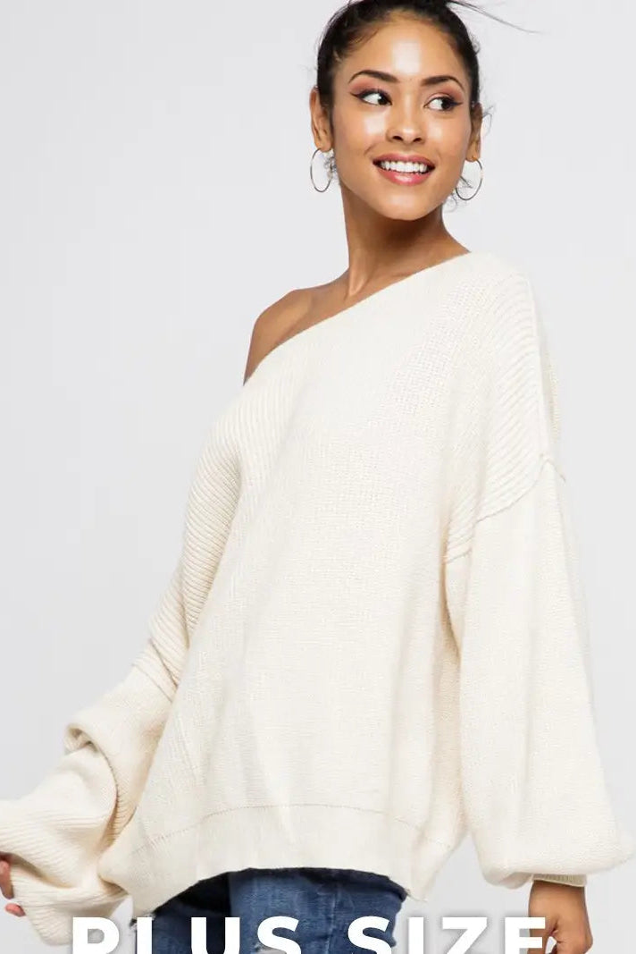 woman wearing off shoulder cream sweater