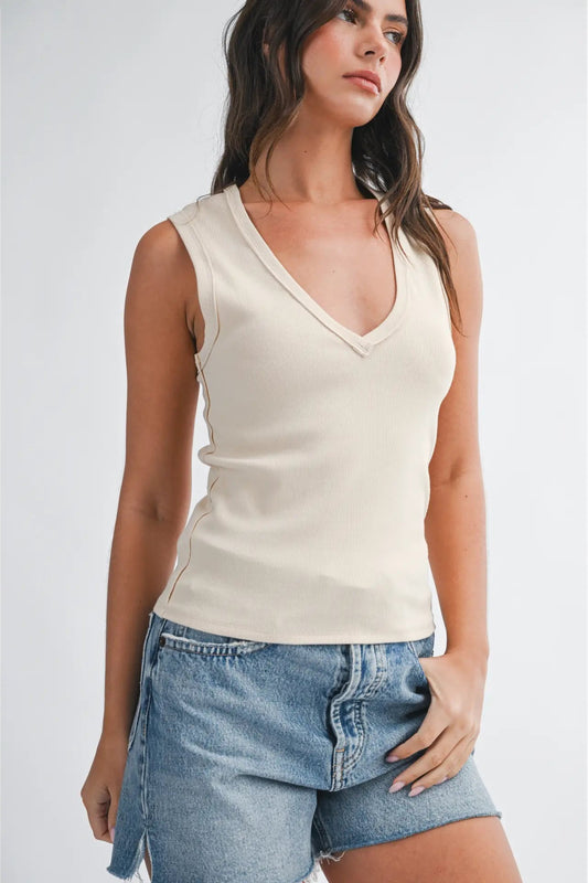 woman wearing tank top with jeans