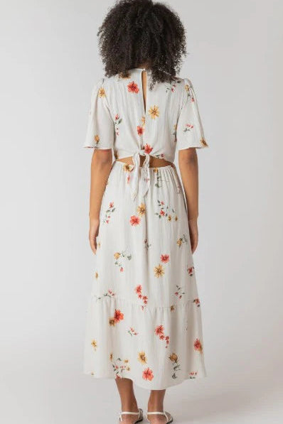 Woman wearing a floral dress with a white background