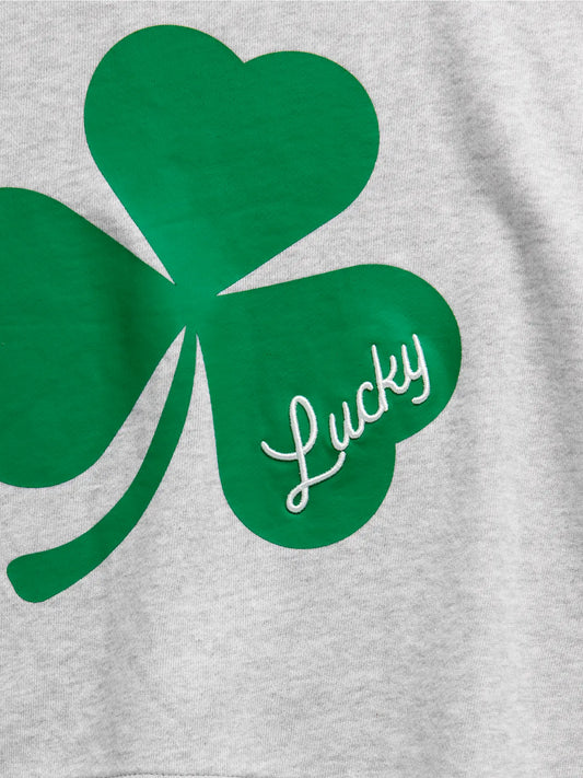 Green shamrock with 'Lucky' text on a gray background
