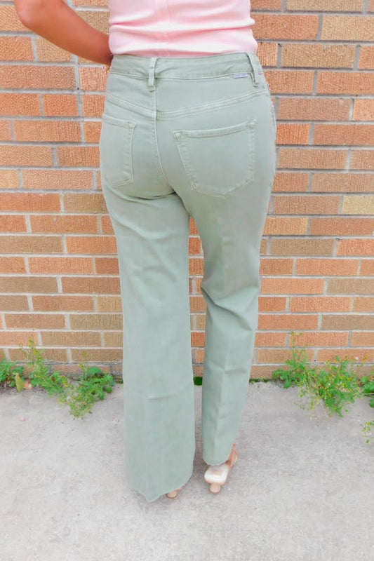 back view of person wearing sage green jeans