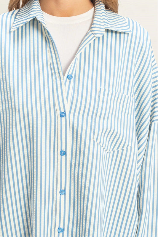woman wearing blue stripe button up shirt