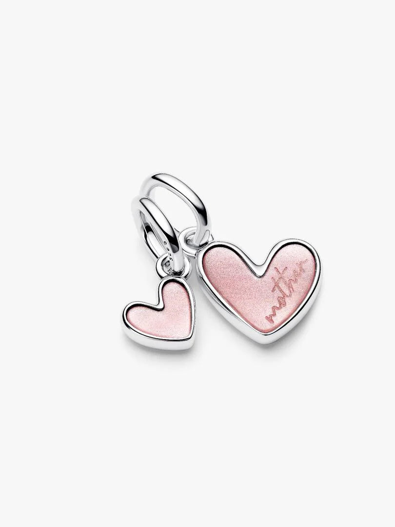 Heart-shaped pendant with pink and silver design on a white background