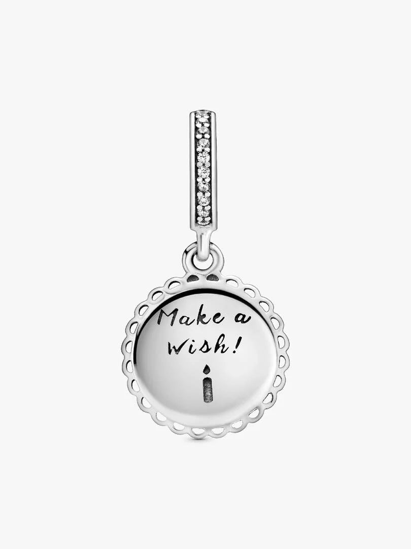 Silver pendant with 'Make a Wish!' engraving on a white background
