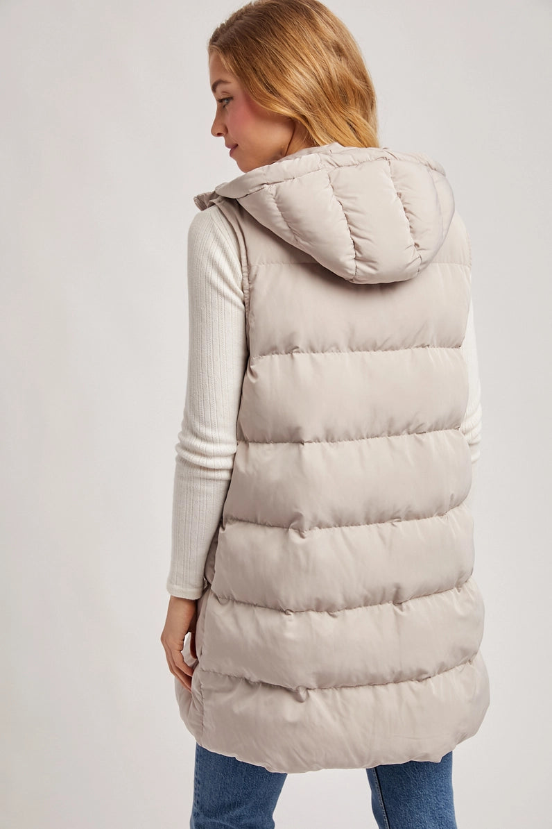 back view of woman in puffer vest