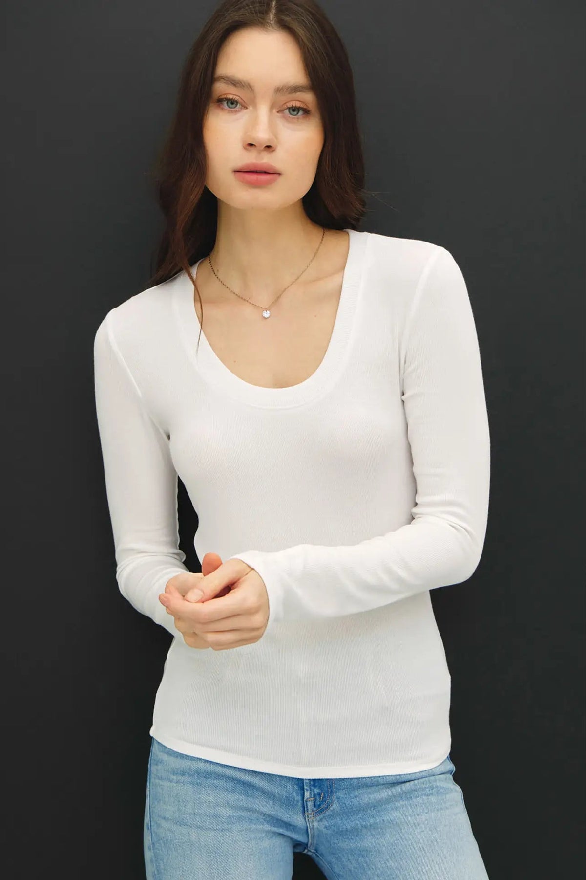 woman in long sleeve top