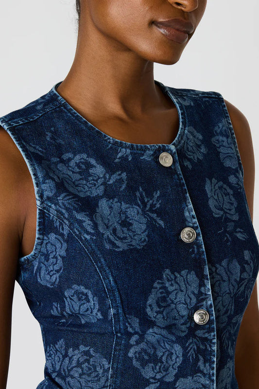 Blue floral patterned vest worn by a person on a white background