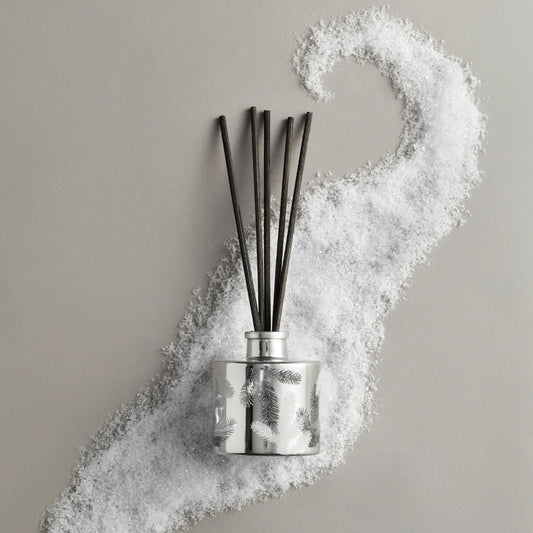 Diffuser with black sticks on a gray background