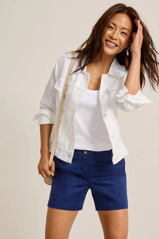 woman wearing white jacket with blue shorts