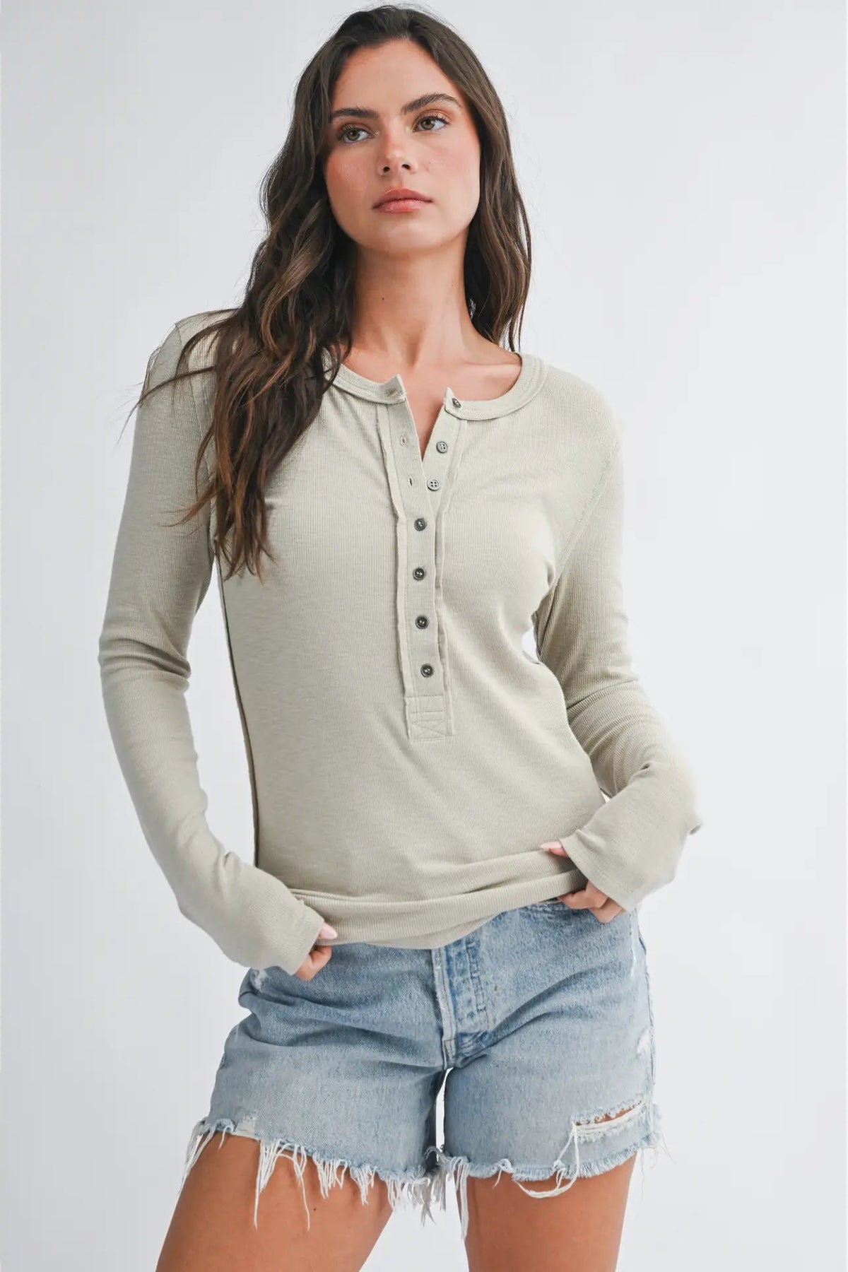 woman wearing henley top and shorts