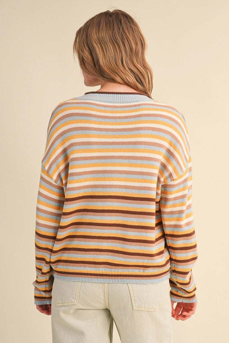 back view of woman in striped cardigan