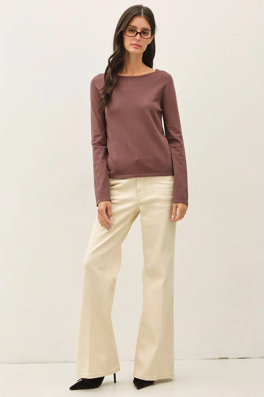 woman in long sleeve top