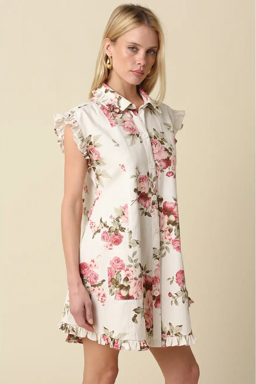 Woman wearing a floral dress against a beige background