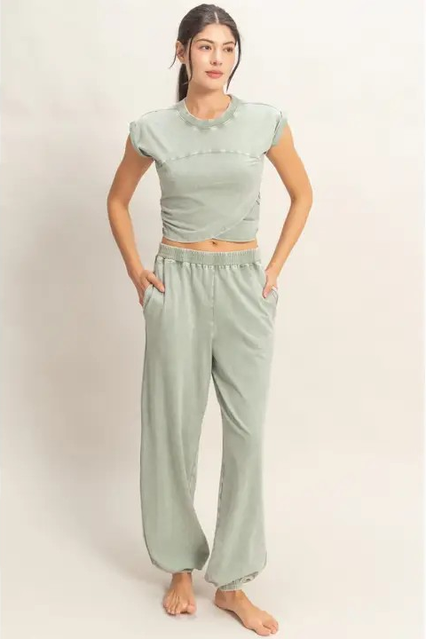 woman wearing green matching jogger set