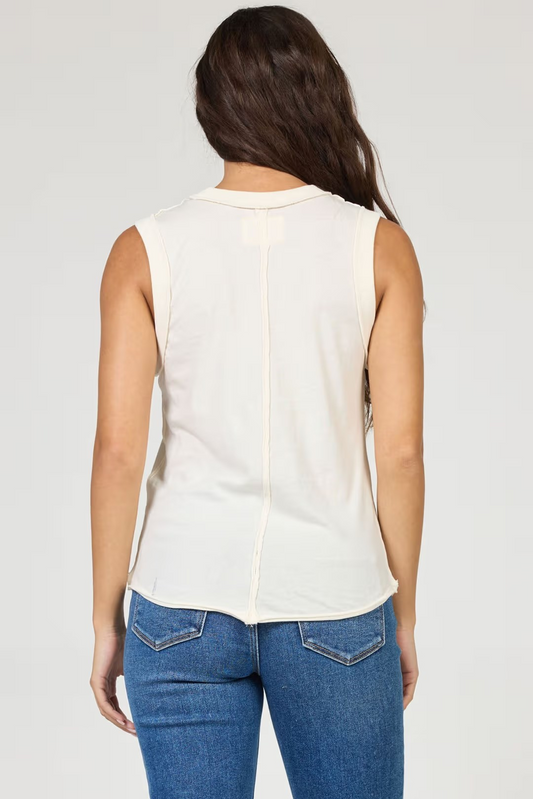 woman wearing cream tank with jeans
