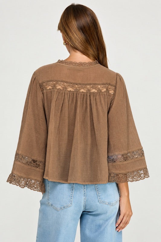 back view of woman in blouse and jeans