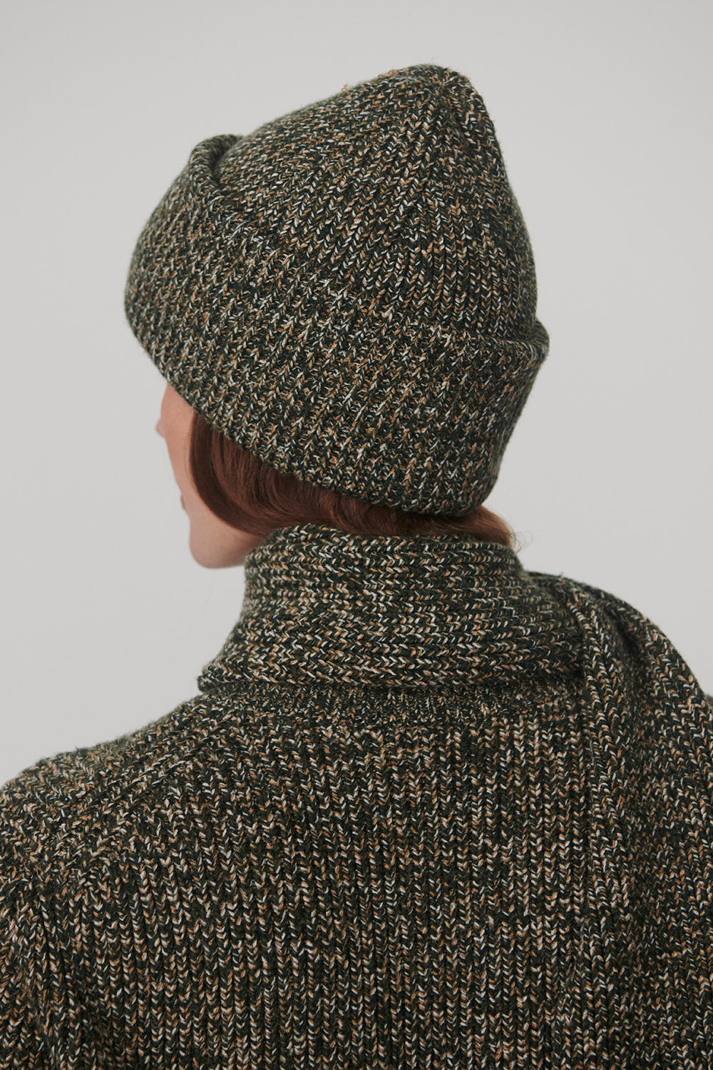 woman wearing scarf and hat