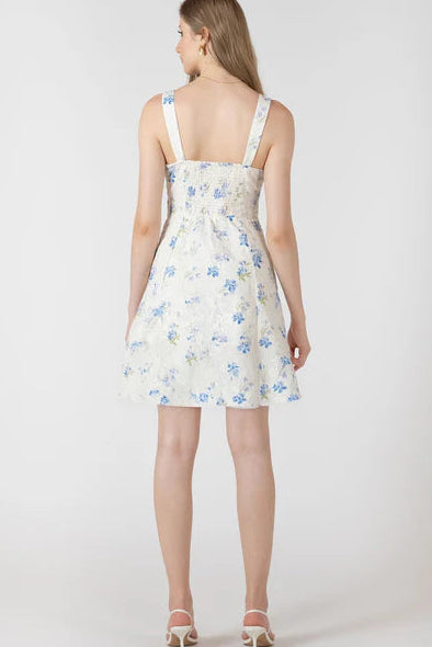 Woman wearing a floral dress on a white background