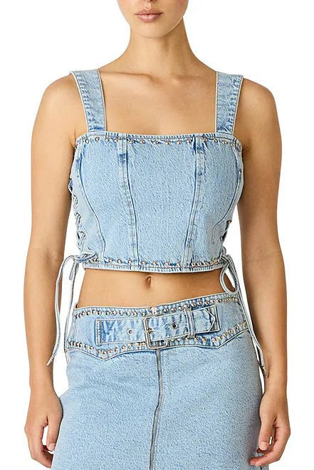 Light blue denim crop top and high-waisted pants on a white background