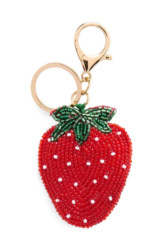 Strawberry-shaped keychain with beaded details on a white background