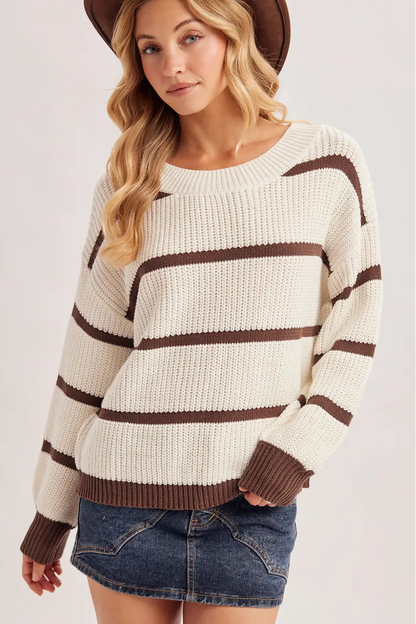 woman in striped sweater and jean skirt 