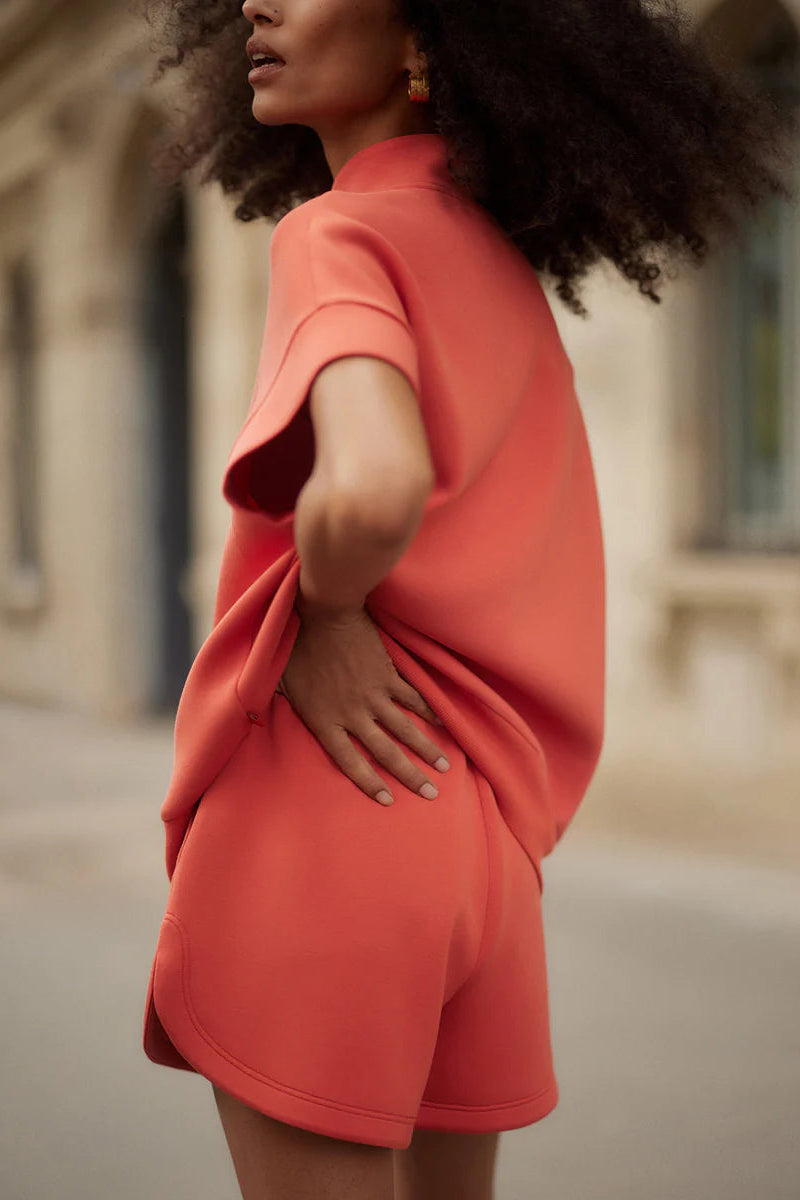 woman wearing red shorts and red top 