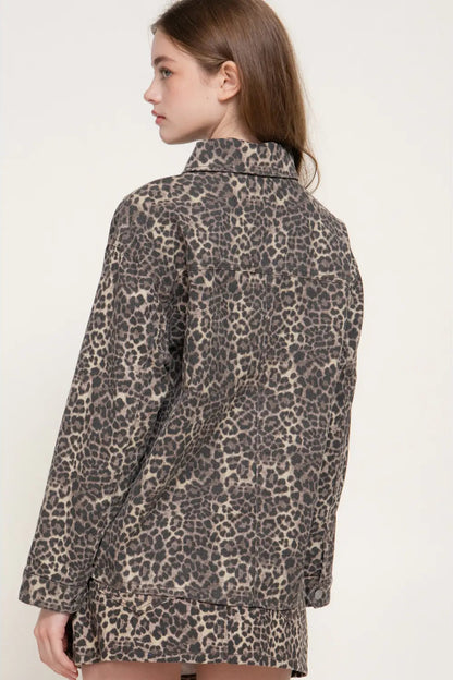 back view of woman in leopard print jacket and skirt 