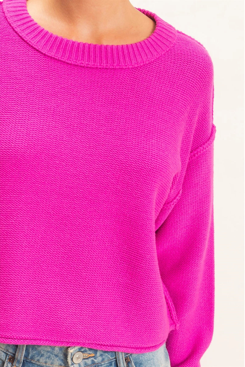 woman wearing pink sweater