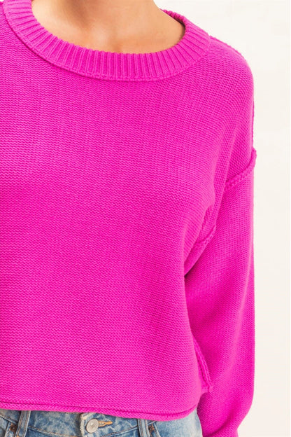 woman wearing pink sweater