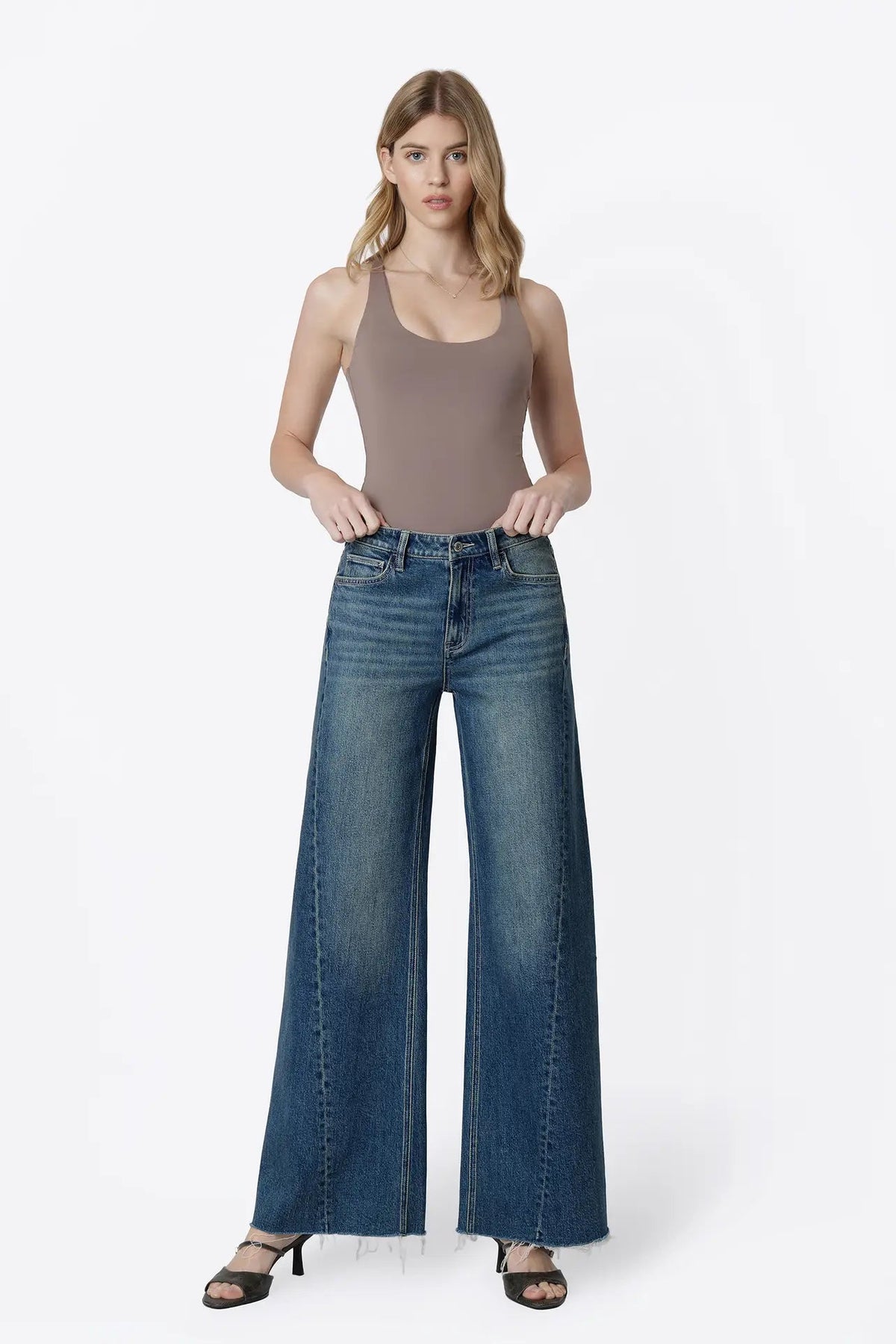 woman in tank and jeans