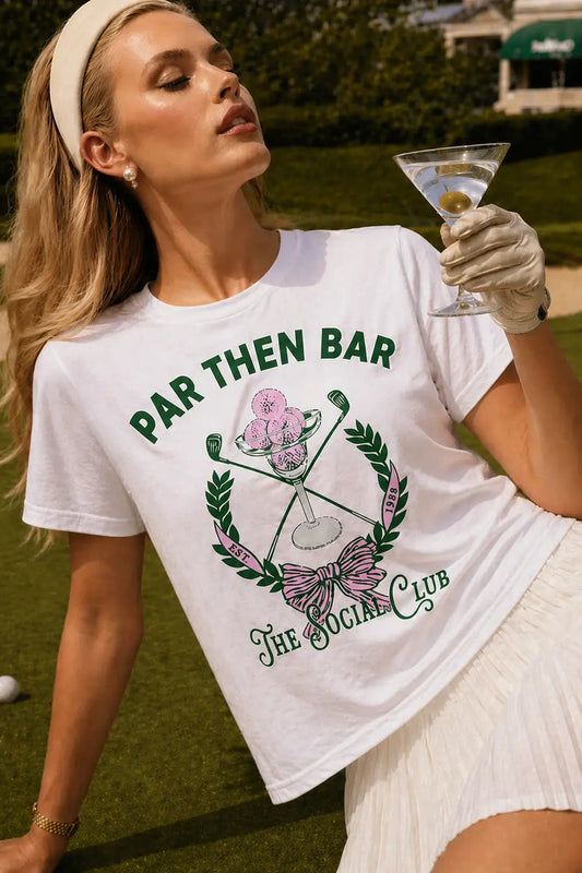 woman wearing par then bar tee with white skirt