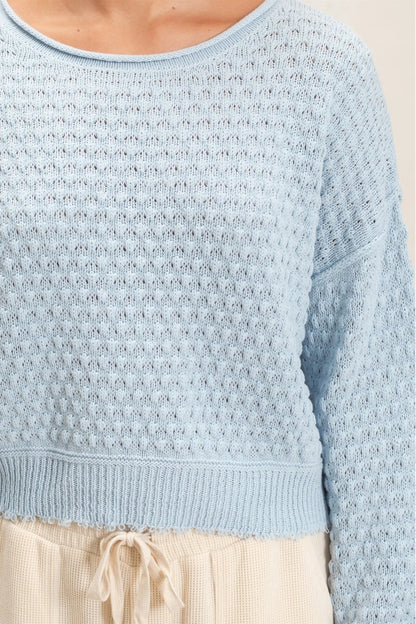 woman wearing blue sweater