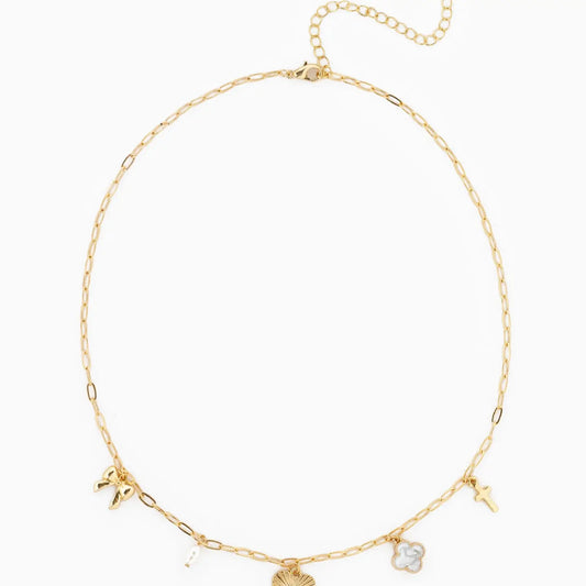 Gold necklace with various charms on a white background