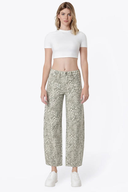 woman wearing white top with leaopard jeans