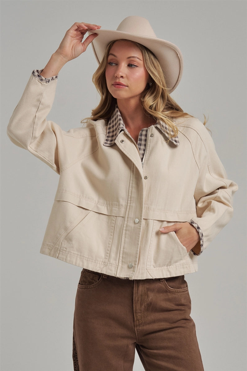 woman in jacket and western hat