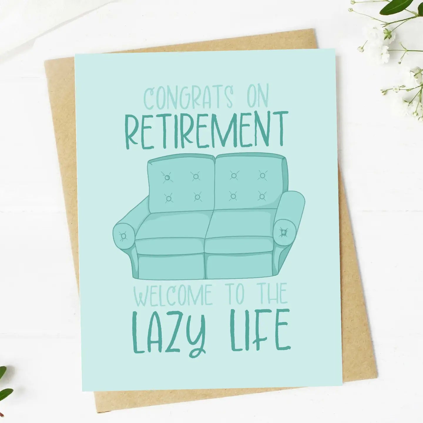 Retirement card with a blue couch illustration and humorous text on a light background.