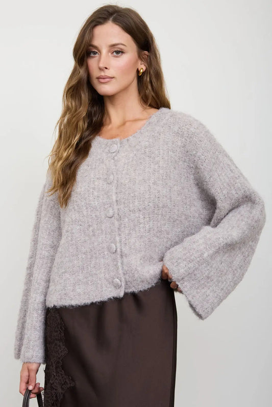 woman in fuzzy cardigan and skirt 
